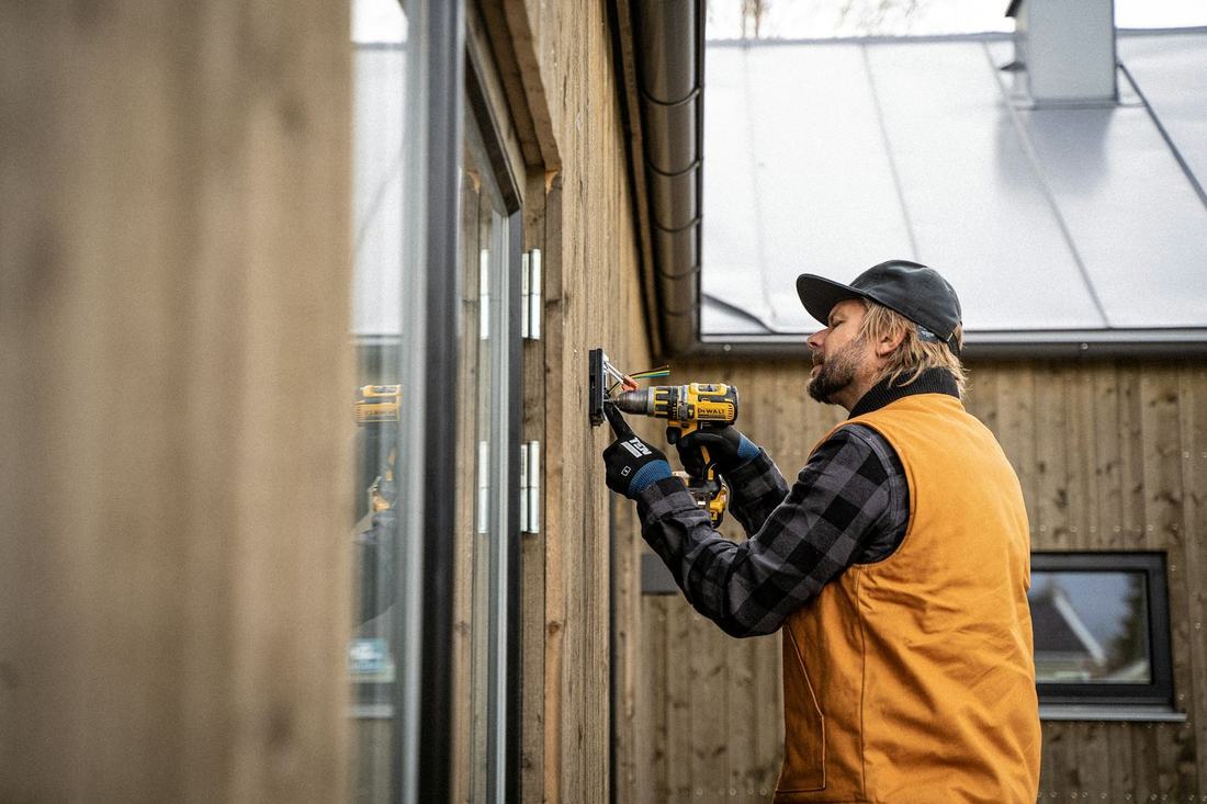Electrician checking an outdoor electrical panel