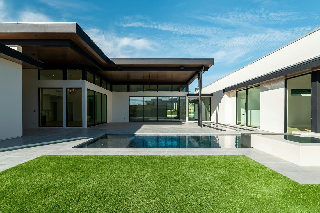 Single-story modern home with a lawn