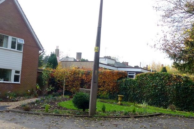 The same front garden with a new lawn and planting beds
